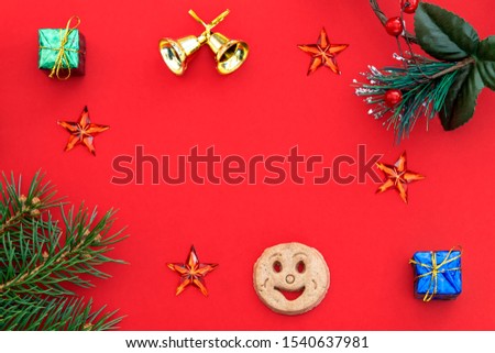 Creative Composition Useful for Christmas and New Year Greeting Card Created Using Gift Boxes, Christmas Bell, Pine Branch, Cookie Smiley, Red Stars and Empty Space For Copy