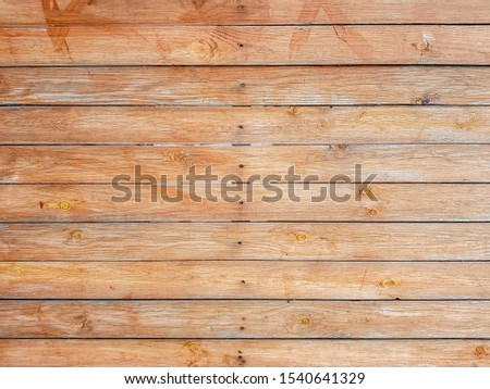 Seamless texture of a brown wooden floor from three rows of boards