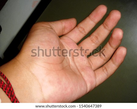 left palm hand of a young asian man.