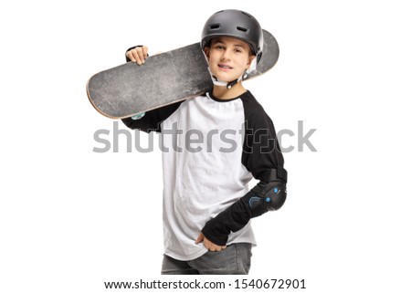 Boy posing with a skateboard on his shoulder isolated on white background