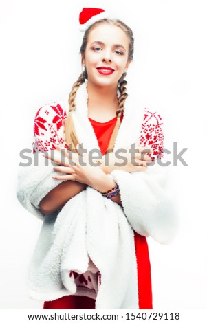 young pretty happy smiling blond woman on christmas in santas red hat and decorated blanket isolated on white background, holiday people