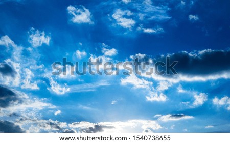 Blue sky with white contrasty clouds