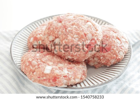 Homemade hamburger patty on dish with copy space
