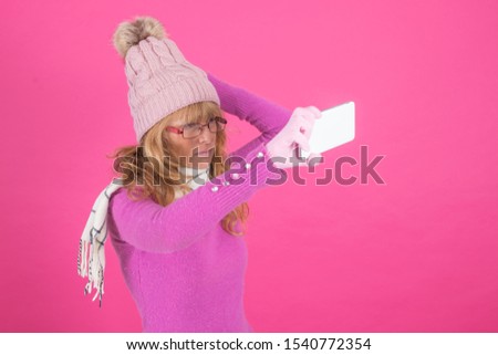 adult woman with warm clothes and mobile phone