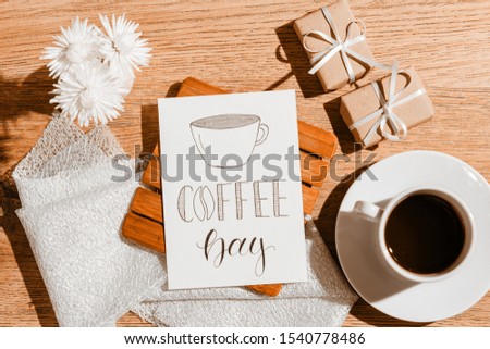 White cup with coffee. Morning breakfast. Greeting card