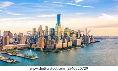 Aerial view with Lower Manhattan skyline at sunset viewed from above Hudson River