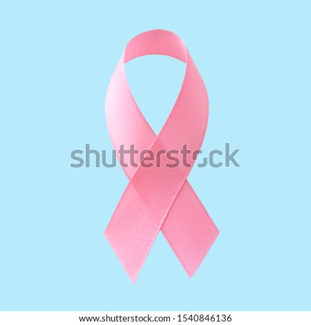 Pink breast cancer ribbon on bule background, Concept World breast cancer day, flat lay copy space for text