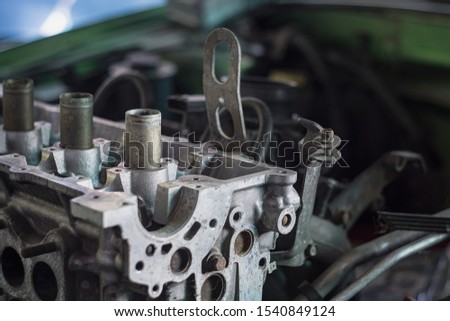 Selective focus of pipe inside car engine when open engine for fix or repair.