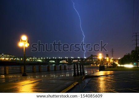 Lightning strike over the Mississippi river and bridges, downtown. Saint Paul, Minnesota