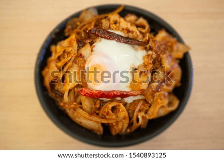 Pork sliced in red hot spicy Korean sauce rice bowl, stock photo