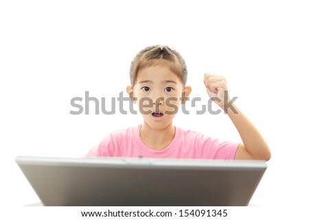 Smiling girl using a laptop