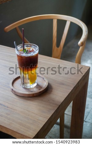 Signature drink of iced peach black coffee, stock photo