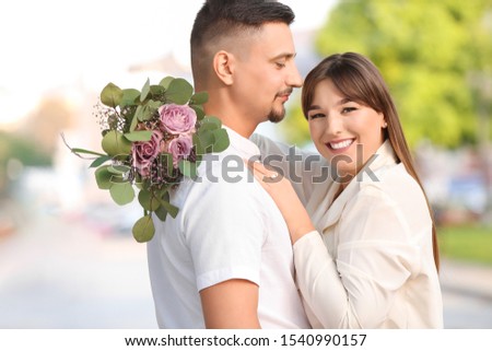 Happy young couple on romantic date outdoors