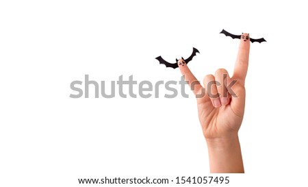 Halloween. Woman fingers with paper bats isolated on white background, panorama, copy space