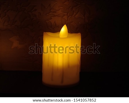 White candle in dark Light 