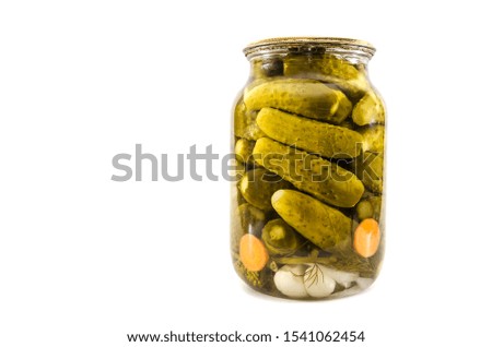 cucumbers in a jar isolated on a white background. Place for text.