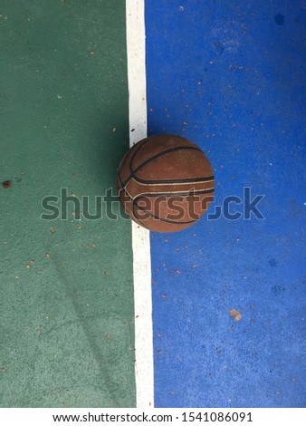  Old Basketball ball on basketball court ,Vintage style.