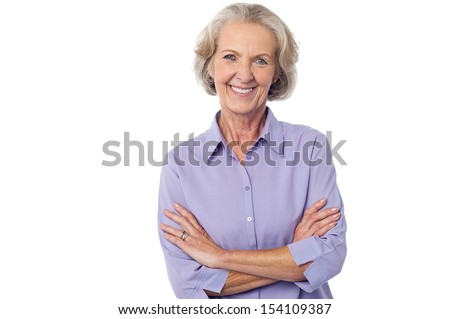Isolated aged lady posing with crossed arms