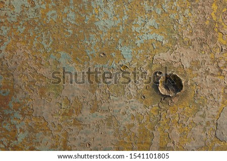 Old military relief texture of the tank green color. The marks of bullets and shrapnel on Board the armoured military vehicle Royalty-Free Stock Photo #1541101805