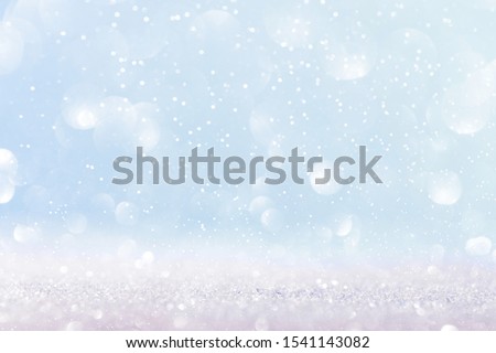 Chritmas light background with snow and blue sky. Design background