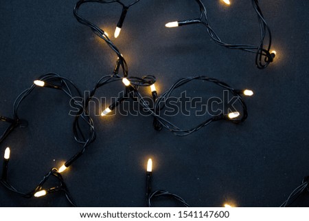 Orange Christmas lights on black background