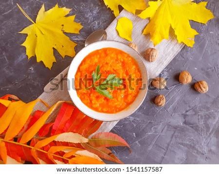 pumpkin porridge autumn leaves on a concrete background