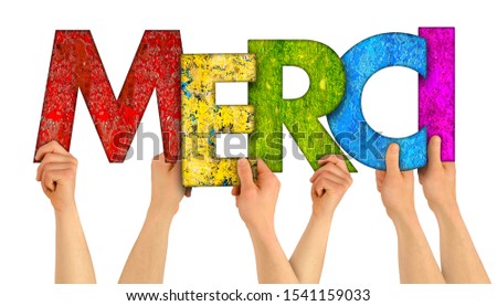 people holding up colorful rainbow wooden letter with the french word Merci (english traslation: thank you) isolated on white background. grateful happy love concept. Royalty-Free Stock Photo #1541159033