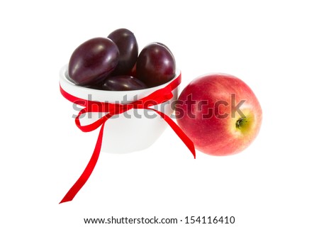 a Image of fruit apples and plums in a bowl