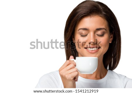 happy woman with closed eyes holding cup of coffee, isolated on white