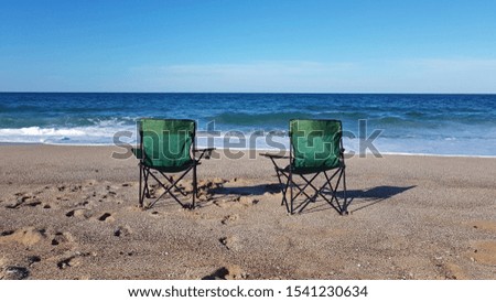 Ocean sea and  two chair   on sand beach 