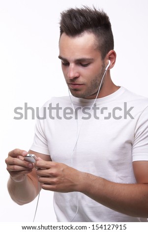 Portrait of a man listening to music on iPod Royalty-Free Stock Photo #154127915