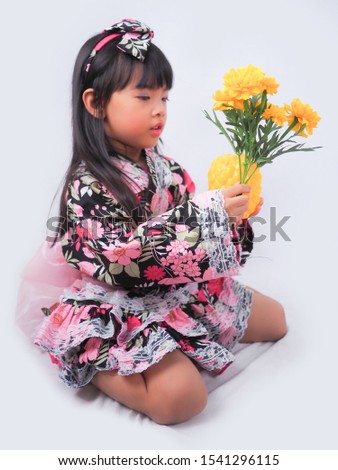 asian little girl  Wearing yukata on white background