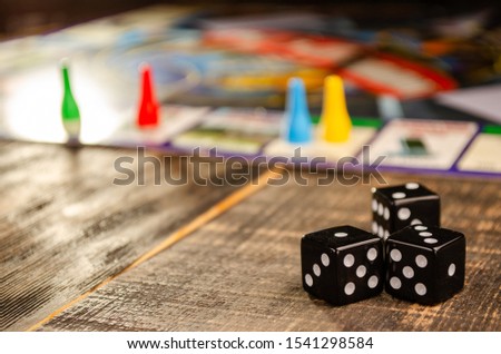 board game on a black wooden background with a sunbeam