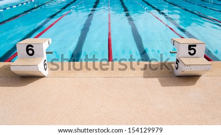 clear blue water in large swimming pool Royalty-Free Stock Photo #154129979