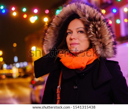 Woman outdoor on a cold winter evening