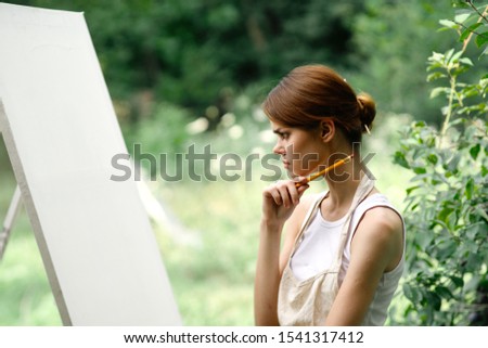 young slender woman in a forest glade girl