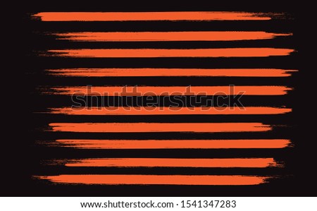 Orange brush stroke set isolated on black background.Trendy brush stroke for orange ink paint, grunge backdrop, dirt banner, watercolor design and dirty texture.Creative art concept, vector illustration