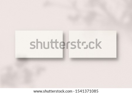 Blank business cards on pink background. Business card with soft shadows. Modern template for branding identity. Photo mockup with clipping path.