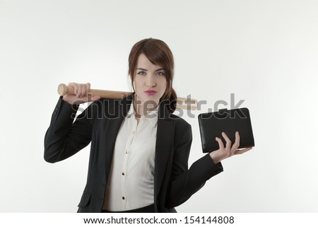 woman in a sharp business suit hold a baseball bat