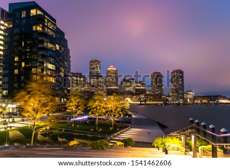 Night view of Boston skyline and watefront from the seaport district