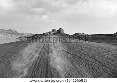 Black and white photography Lonely arid Iranian arid sand desert Kalout Dasht e Lut landscape with dunes 