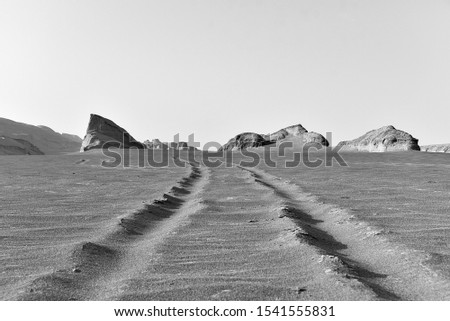 Black and white photography Lonely arid Iranian arid sand desert Kalout Dasht e Lut landscape with dunes 