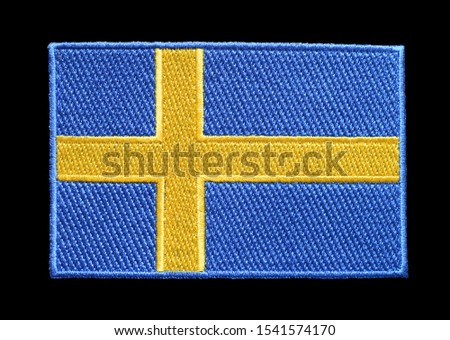 Badge Sweden flag isolated on a black background.