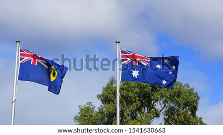 View of a flag of Australia and flag of Western Australia flying side by side