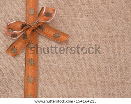 orange bow on the textile background