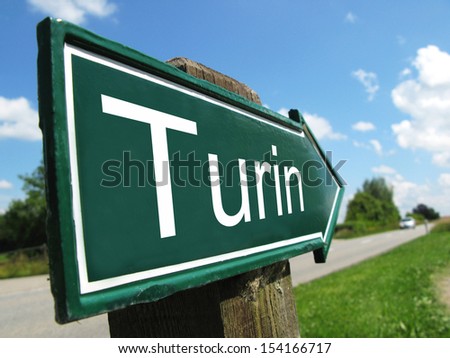 Turin signpost along a rural road