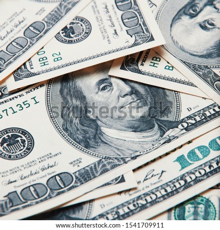 Cash of hundred dollar bills, dollar background image. A pile of one hundred US banknotes.