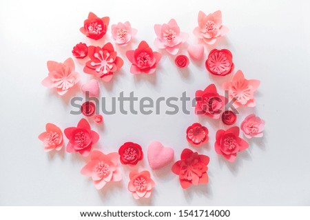 Pink and red flower made of paper. Shape frame place for text. Holiday of all lovers. White background.