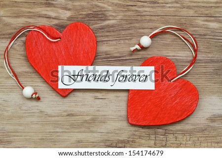 Friends forever card with two red wooden hearts 