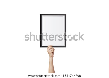 Hand holding and showing empty blank photo frame isolated on white background.